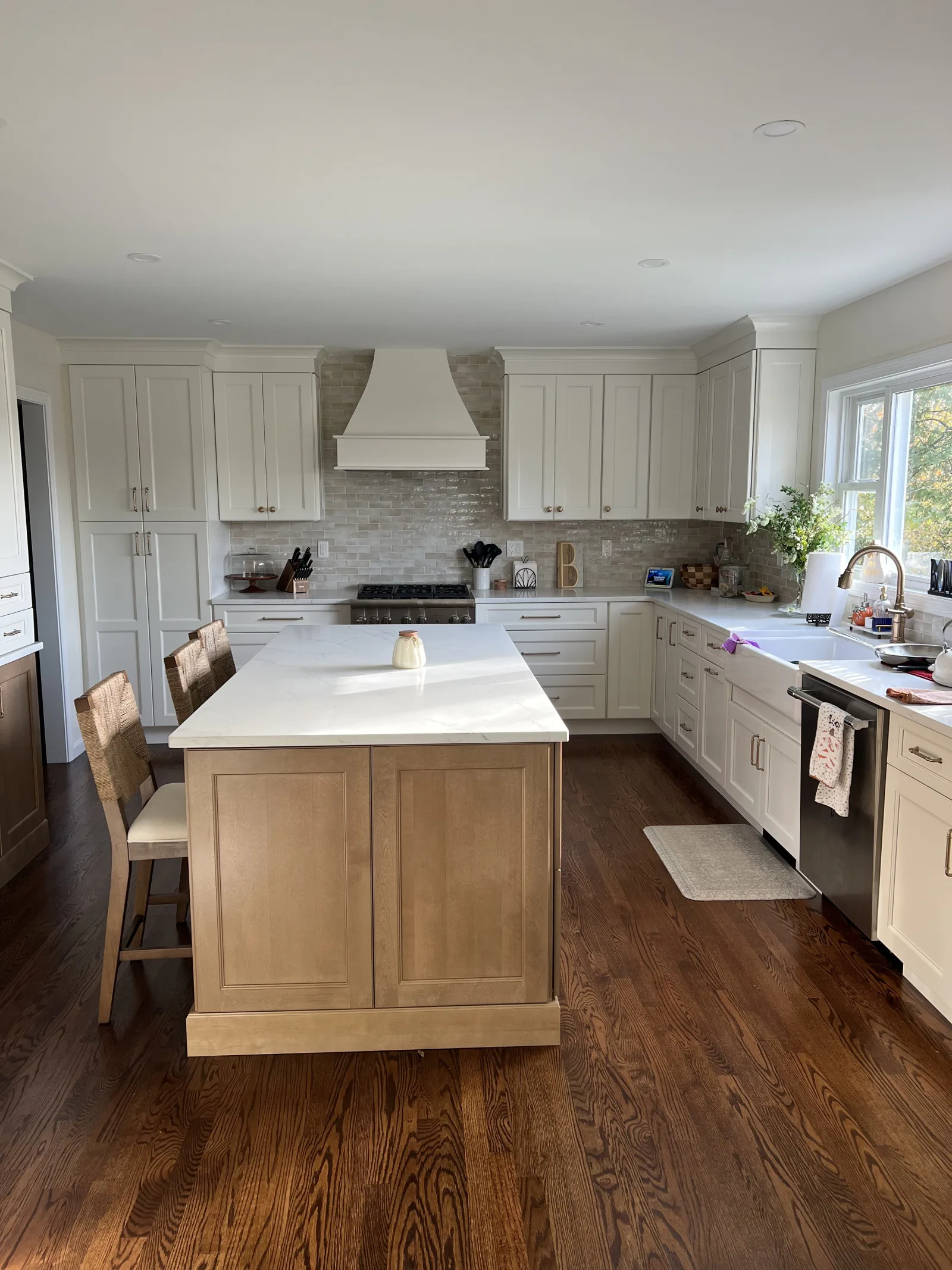 White kitchen with a natural oak island in a central Connecticut home